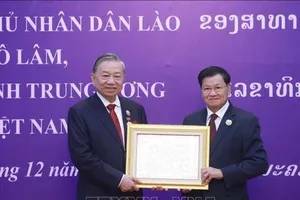 Tổng Bí thư Tô Lâm nhận Huân chương Vàng Quốc gia của Nhà nước Lào