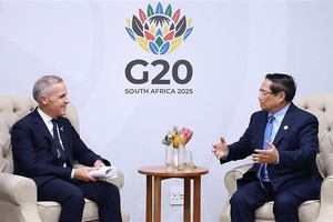 范明政总理会见加拿大总理马克•卡尼。图自越通社