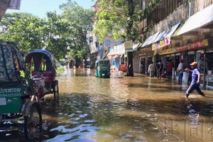 圖為孟加拉國東北部的洪水災區。攝於7月3日。（Getty=共同社）