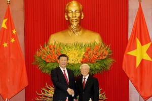 黨中央總書記阮富仲與中國共產黨中央總書記、中華人民共和國主席習近平。