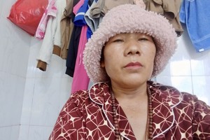 阮氏金贤向社会求助医治癌症。