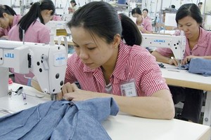 Workers at Japanese company, IGM, in District 7 in Ho Chi Minh City. (Photo: SGGP)