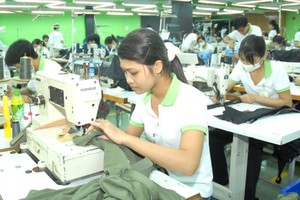 Workers are making clothes for export at a company in Ho Chi Minh City. (Photo: SGGP)