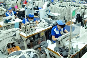 Production at Nha Be Garment Joint Stock Corporation. (Photo: SGGP)