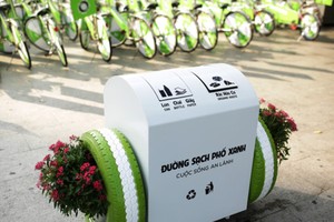 Bridgestone donates 100 smart trash bins to city
