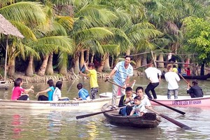 Visitors at My Khanh Tourist Village