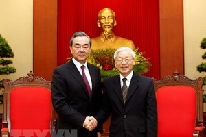 eneral Secretary of the Communist Party of Vietnam Nguyen Phu Trong (R) receives Chinese State Councillor and Foreign Minister Wang Yi in Hanoi on April 2 (Photo: VNA)