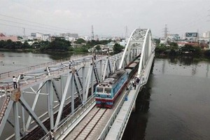 The new Binh Loi Bridge crossing Sai Gon River in HCM City opens to train traffic on September 14. (Photo: VNA/VNS)