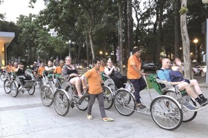 Foreign visitors in HCMC. (Photo: VNS)
