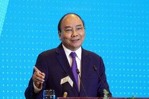 Prime Minister Nguyen Xuan Phuc addresses the “Hanoi 2020 – Investment & Development Cooperation” conference on June 27 (Photo: VNA)