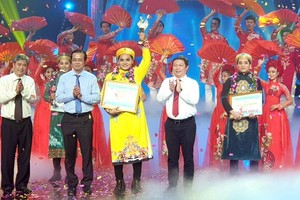 Nguyen Quoc Nhut (yellow Ao dai) is winner of the 2020 Cai Luong Singing Contest called Chuong Vang (Golden Bell) Vong Co.
