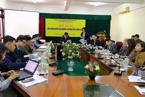 Delegates discuss problems and solutions to ensure better rights for Vietnamese guest workers abroad at a conference held on January 15 (Photo: VNA) 