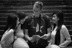 Friendly smiles of Vietnamese people and foreign visitors in HCMC (2011)