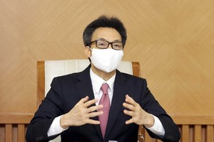 Deputy Prime Minister Vu Duc Dam speaks at the online discussion with WHO Regional Director for the Western Pacific Takeshi Kasai on June 17 (Photo: VNA)