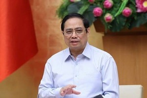 Prime Minister Pham Minh Chinh chairs the meeting of the Central Emulation and Rewards Council in Hanoi on August 14 (Photo: VNA)