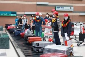 First international tourists arrive in Vietnam after reopening.