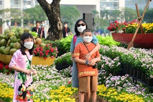 Visitors taking pictures of flower street in Phu My Hung Urban Area