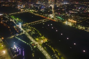 Seven giant lotus-shaped paper lanterns are lighted up  on the Huong River.