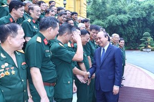 President Nguyen Xuan Phuc receives the Liaison Board of the Association of War Veterans of the Vi Xuyen Front in Ha Tuyen province (now Ha Giang province) . (Photo: SGGP)