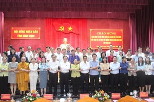 Leaders of HCMC and Binh Dinh Province attend a working session on supervision activities of the People’s Council .