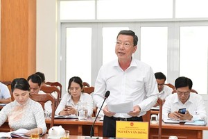 Chairman of the People’s Committee of HCMC Phan Van Mai speaks at the event.