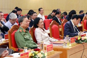 Politburo member and Permanent member of Party Central Committee's Secretariat Truong Thi Mai (2nd, R) and Minister of Public Security, General To Lam (L) attend the conference. (Photo: SGGP)