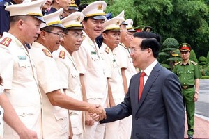 President Vo Van Thuong greets participants in the meeting in Hanoi on June 14. (Photo: VNA)