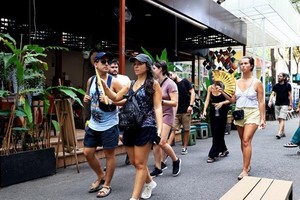 Spanish tourists visit Book Street in Ho Chi Minh City. (Photo: VNA)