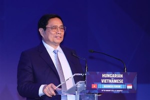 Prime Minister Pham Minh Chinh speaks at the Vietnam-Hungary business forum in Budapest on January 19 (local time)(Photo: VNA)