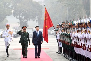 State President Luong Cuong attended a national political-military conference in Hanoi on December 26. (Photo: SGGP)