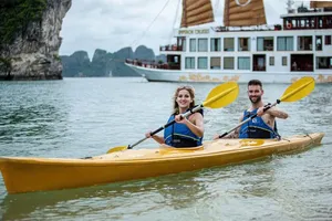 International tourists row a kayaks in Ha Long Bay , Quang Ninh Province. (Photo: SGGP)