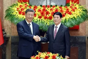 State President Luong Cuong (R) and General Secretary of the Communist Party of China (CPC) Central Committee and President of China Xi Jinping. (Photo: SGGP)