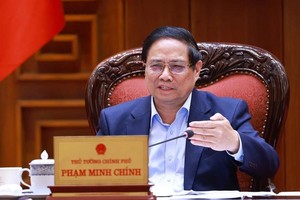 Prime Minister Pham Minh Chinh calls for breakthrough policies for Vietnam's international financial center. (Photo: VNA)