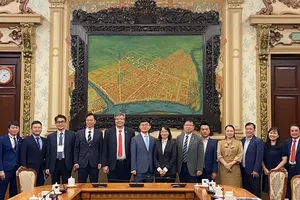 Delegates of the two sides attend the event. (Photo: SGGP)