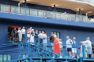 International tourists arriving in Vietnam aboard the Celebrity Solstice disembark to tour Ho Chi Minh City.