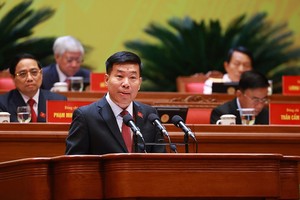 Member of the Party Central Committee, Deputy Minister of Foreign Affairs Nguyen Manh Cuong delivers a presentation at the 14th National Party Congress. (Photo: VNA)
