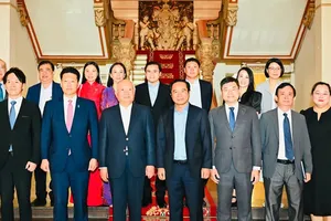 Delegates of the two sides attend the event. (Photo: SGGP)