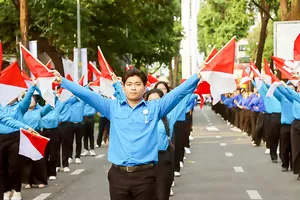 Members of the Ho Chi Minh Communist Youth Union and young people in Ho Chi Minh City take part in a mass performance celebrating the 95th anniversary of the founding of the Ho Chi Minh Communist Youth Union. (Photo: SGGP)