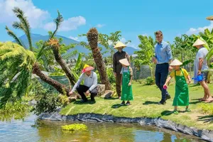 Visitors take part in a hands-on farming experience at a resort on the Cam Ranh Peninsula, Khanh Hoa Province.