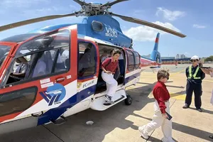 Visitors experience helicopter sightseeing tours over Ho Chi Minh City.
