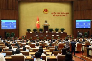 National Assembly adopts a resolution introducing key provisions on environmental protection tax, value-added tax, and excise tax for petrol, oil and jet fuel on April 12 (Photo: VNA)