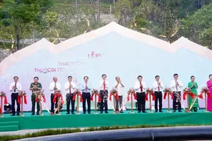 Delegates perform the ribbon-cutting ceremony to inaugurate the Nine-Tier Waterfall project. (Photo: SGGP)