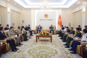 Deputy Prime Minister and Minister of National Defence General Phan Van Giang hosts a reception in Hanoi on June 22 for Acting US Secretary of the Navy Hung Cao.