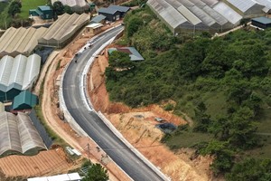 The road required extensive excavation of high hillsides and stabilization of numerous cut slopes to shorten the travel distance.