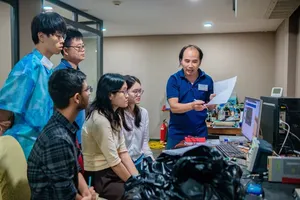 Researchers from the Neutrino Physics Group at IFIRSE discuss their scientific work. (Photo: ICISE)