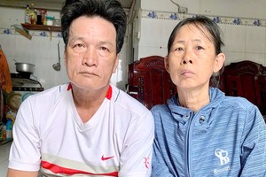 阮文事和妻子黎氏帽。