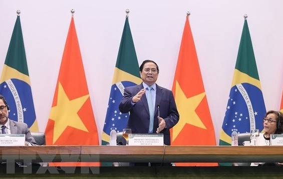 政府总理范明政出席在巴西外交部举行的座谈会。图自越通社