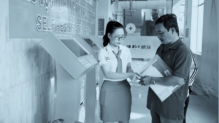 Patients are checking in a hospital using the kiosk system