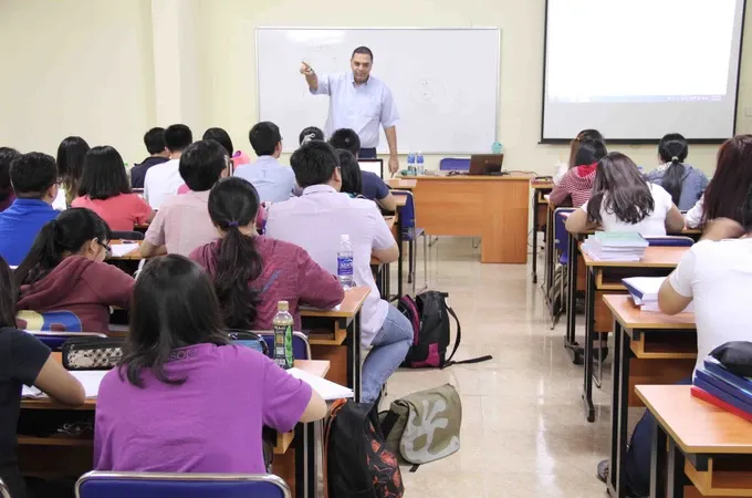 A foreign lecturer is teaching a lesson in HCMC University of Finance - Marketing