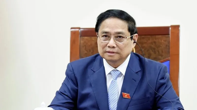 Thủ tướng Phạm Minh Chính điện đàm với Thủ tướng Singapore Lawrence Wong. Ảnh: TTXVN
